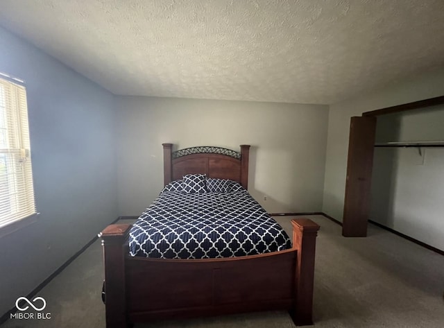 carpeted bedroom with a textured ceiling