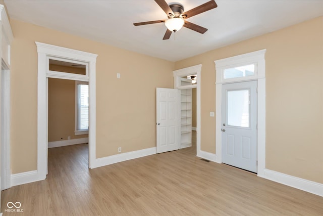 interior space featuring ceiling fan, plenty of natural light, and light hardwood / wood-style floors