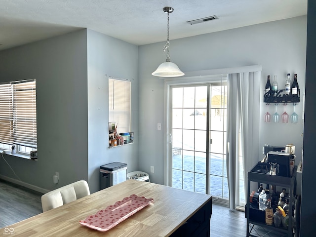 dining area with wood-type flooring