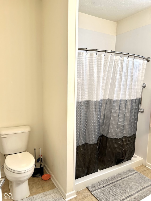 bathroom with toilet and walk in shower