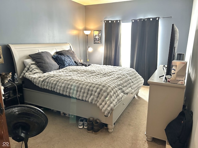 bedroom featuring light colored carpet