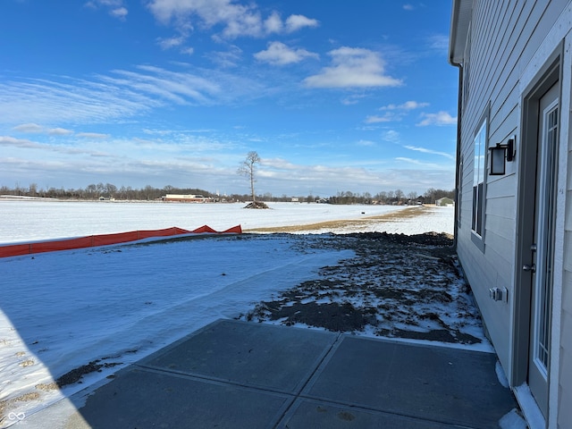 view of yard layered in snow