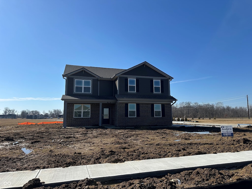 view of front of home with brick siding