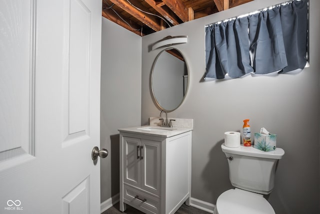 bathroom featuring toilet and vanity