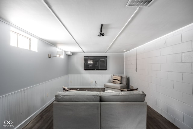 cinema room with dark wood-type flooring