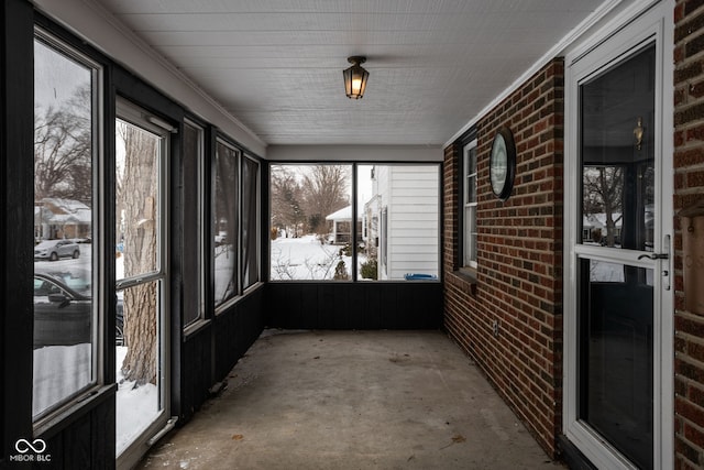 unfurnished sunroom with plenty of natural light