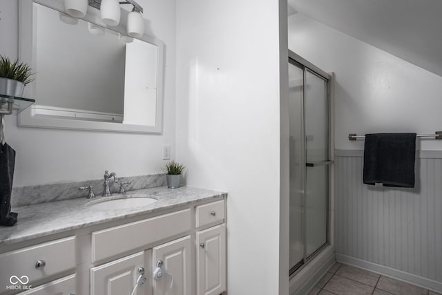 bathroom featuring vanity, tile patterned floors, and walk in shower