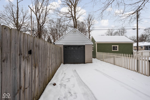 view of snow covered garage