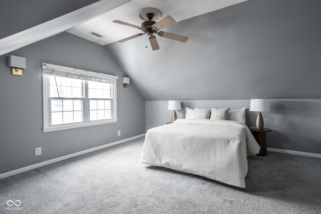 carpeted bedroom with ceiling fan and vaulted ceiling