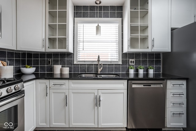 kitchen with sink, white cabinets, and appliances with stainless steel finishes