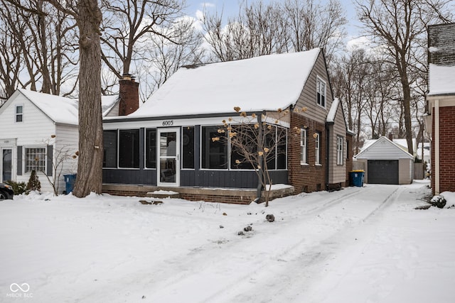 view of front of house with an outbuilding and a garage