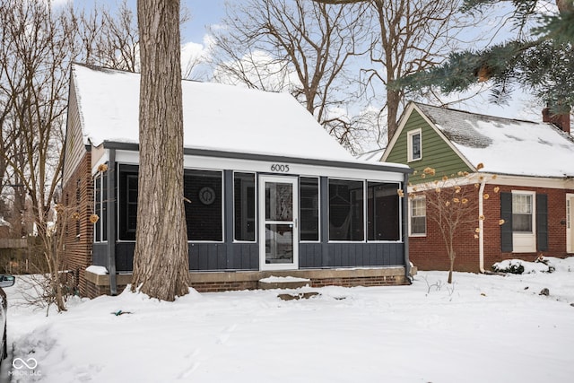 view of front facade featuring a sunroom