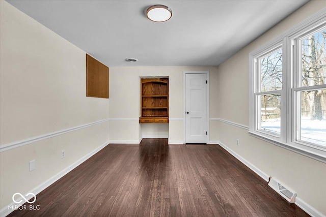 empty room featuring dark hardwood / wood-style floors