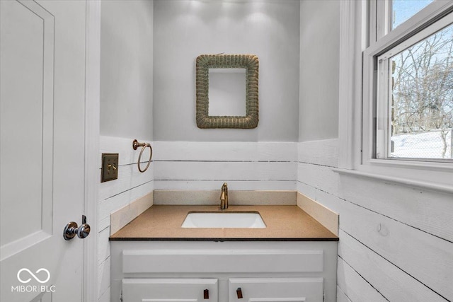 bathroom with plenty of natural light and vanity