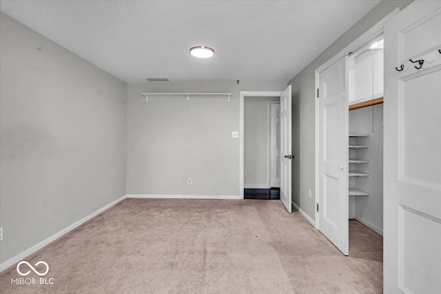 unfurnished bedroom with light carpet