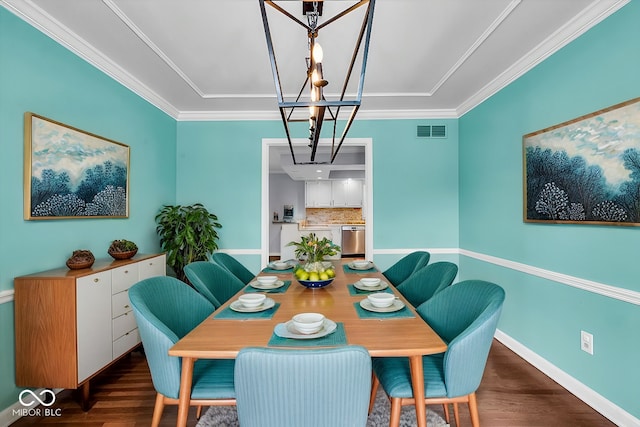 dining area with crown molding and dark hardwood / wood-style flooring