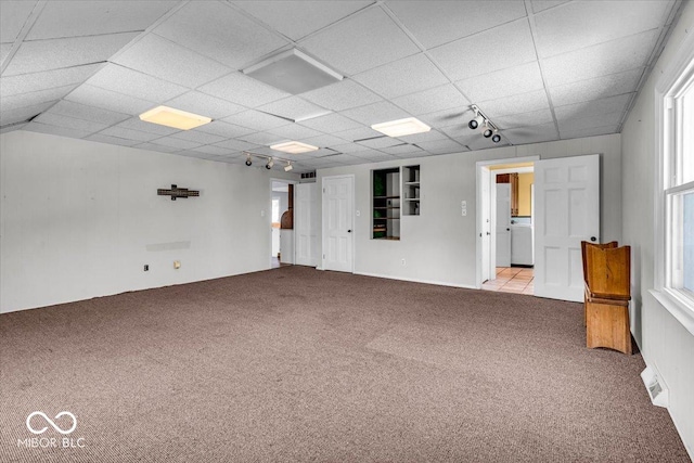 empty room with light carpet and plenty of natural light