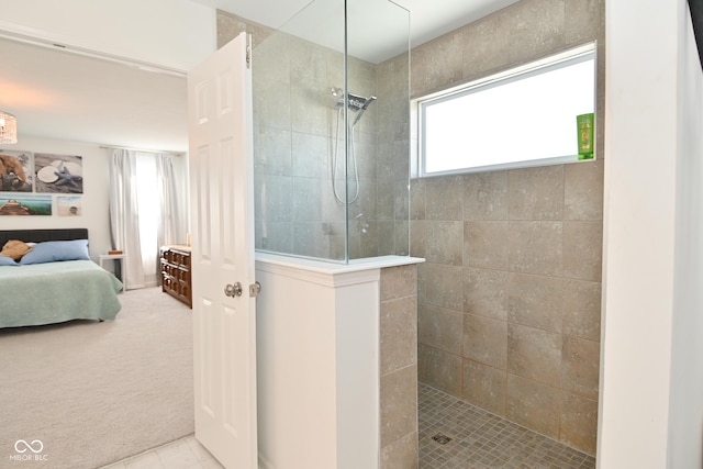 bathroom with a wealth of natural light and tiled shower