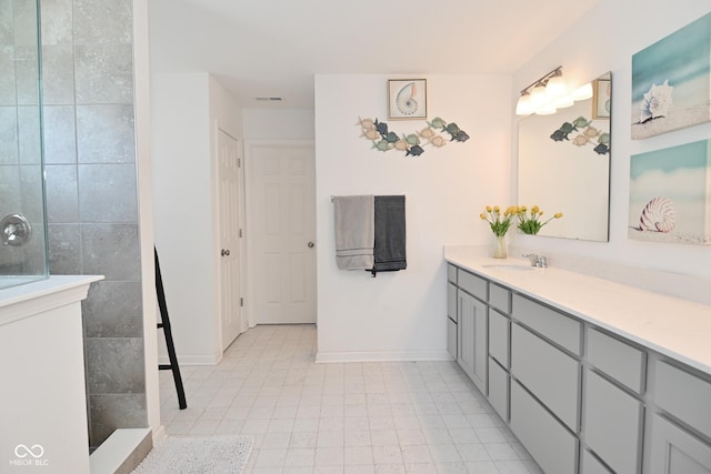 bathroom with walk in shower and vanity