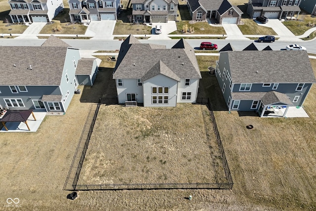 birds eye view of property with a residential view