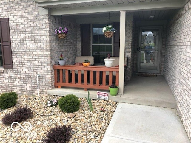 entrance to property with a porch