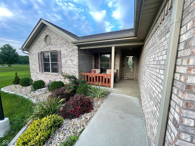 doorway to property featuring covered porch