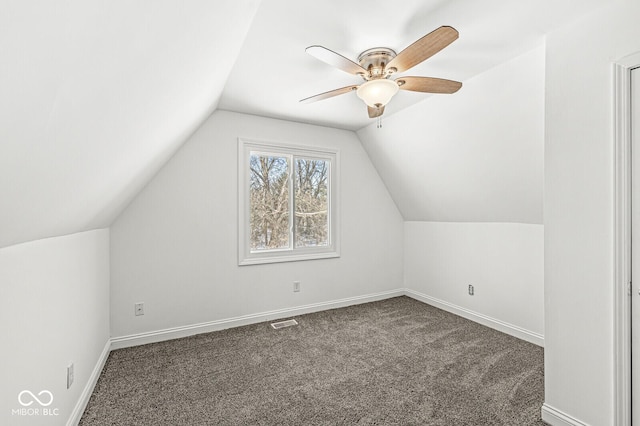 additional living space with a ceiling fan, baseboards, visible vents, carpet floors, and lofted ceiling