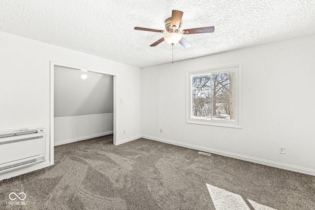 unfurnished room featuring visible vents, a textured ceiling, carpet flooring, baseboards, and ceiling fan