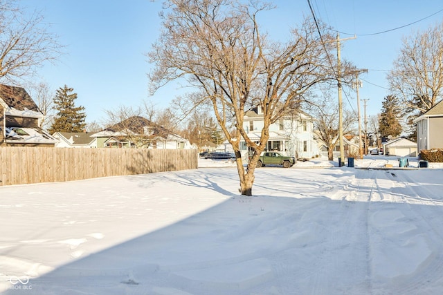 view of yard layered in snow