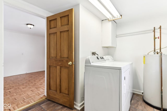 laundry room with independent washer and dryer, dark parquet flooring, and gas water heater