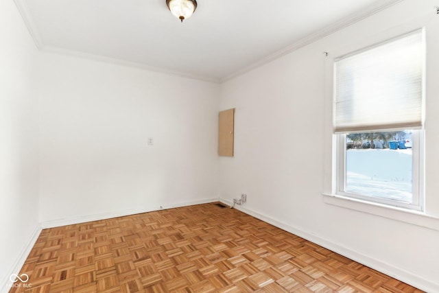 unfurnished room with electric panel, crown molding, and light parquet flooring