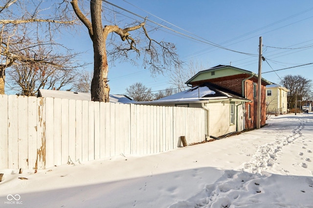 view of yard layered in snow