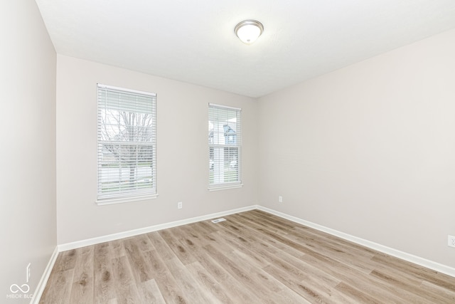 unfurnished room featuring light wood-type flooring