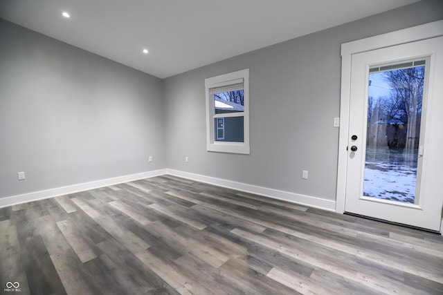 empty room featuring hardwood / wood-style flooring