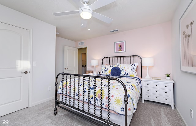 carpeted bedroom with ceiling fan