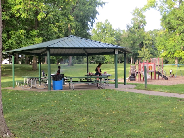 view of property's community with a gazebo, a lawn, and a playground