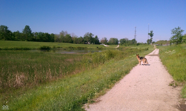 view of street featuring a water view and a rural view