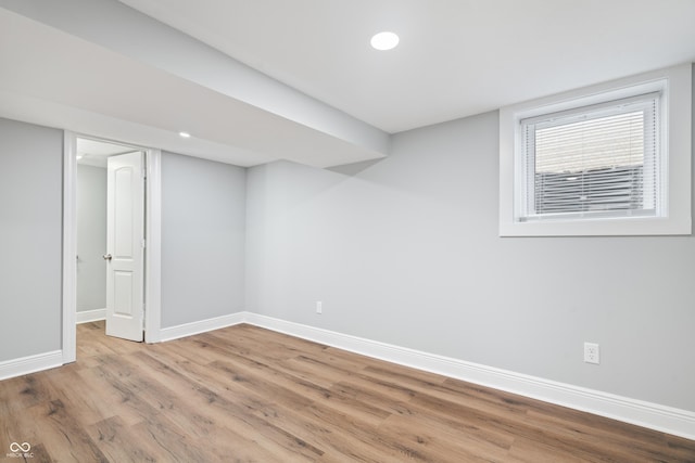 basement featuring hardwood / wood-style floors