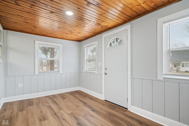 entrance foyer featuring wooden ceiling and light wood-type flooring