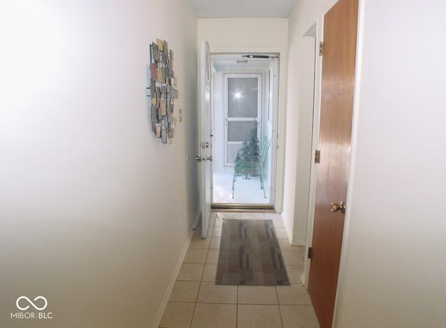 corridor featuring light tile patterned floors