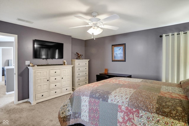 bedroom with light colored carpet and ceiling fan