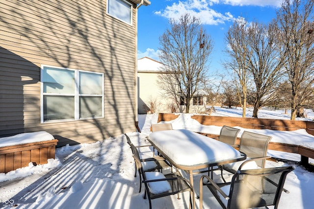 view of snow covered deck