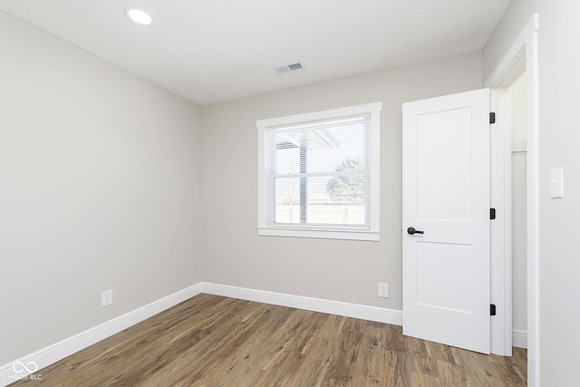 empty room featuring wood-type flooring