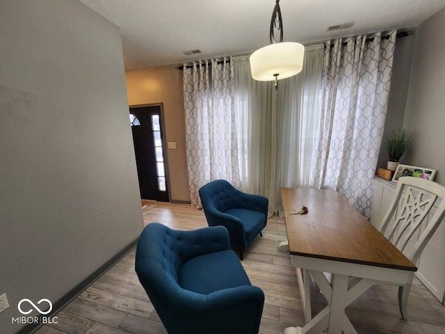 dining space featuring light hardwood / wood-style floors