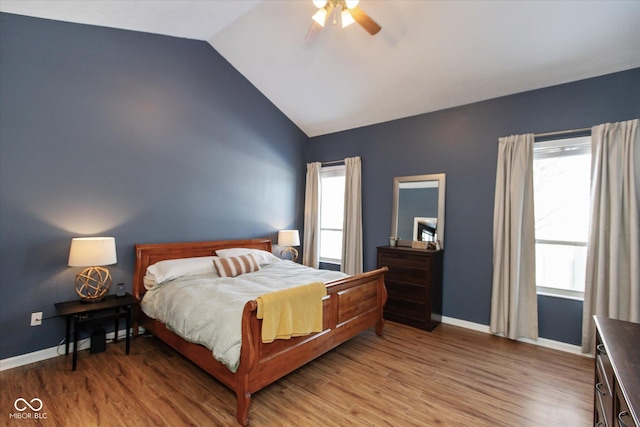 bedroom with lofted ceiling, wood-type flooring, and ceiling fan