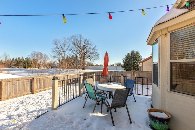 view of snow covered patio