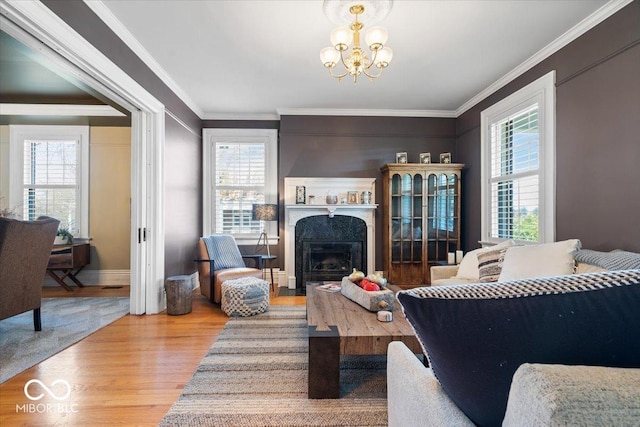 living room with hardwood / wood-style floors, a healthy amount of sunlight, and crown molding