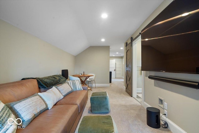 living room with light carpet, a barn door, and lofted ceiling