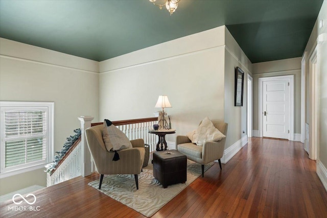 living area with dark hardwood / wood-style flooring