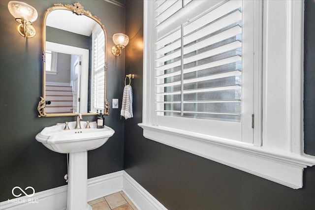 bathroom with tile patterned floors